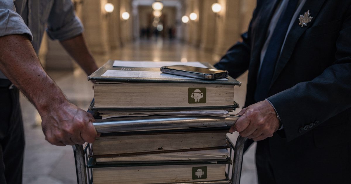 Close-up of two hands wheeling a cart stacked with thick trade-agreement binders down a marble government corridor at dusk, a maple-leaf lapel pin visible on a.